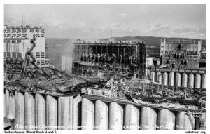 black and white image of the elevator overall after explosion. the inner building has fallen inward