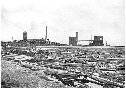 black and white elevator annex being built. text on bottom says "Pigeon River Lumber Co."