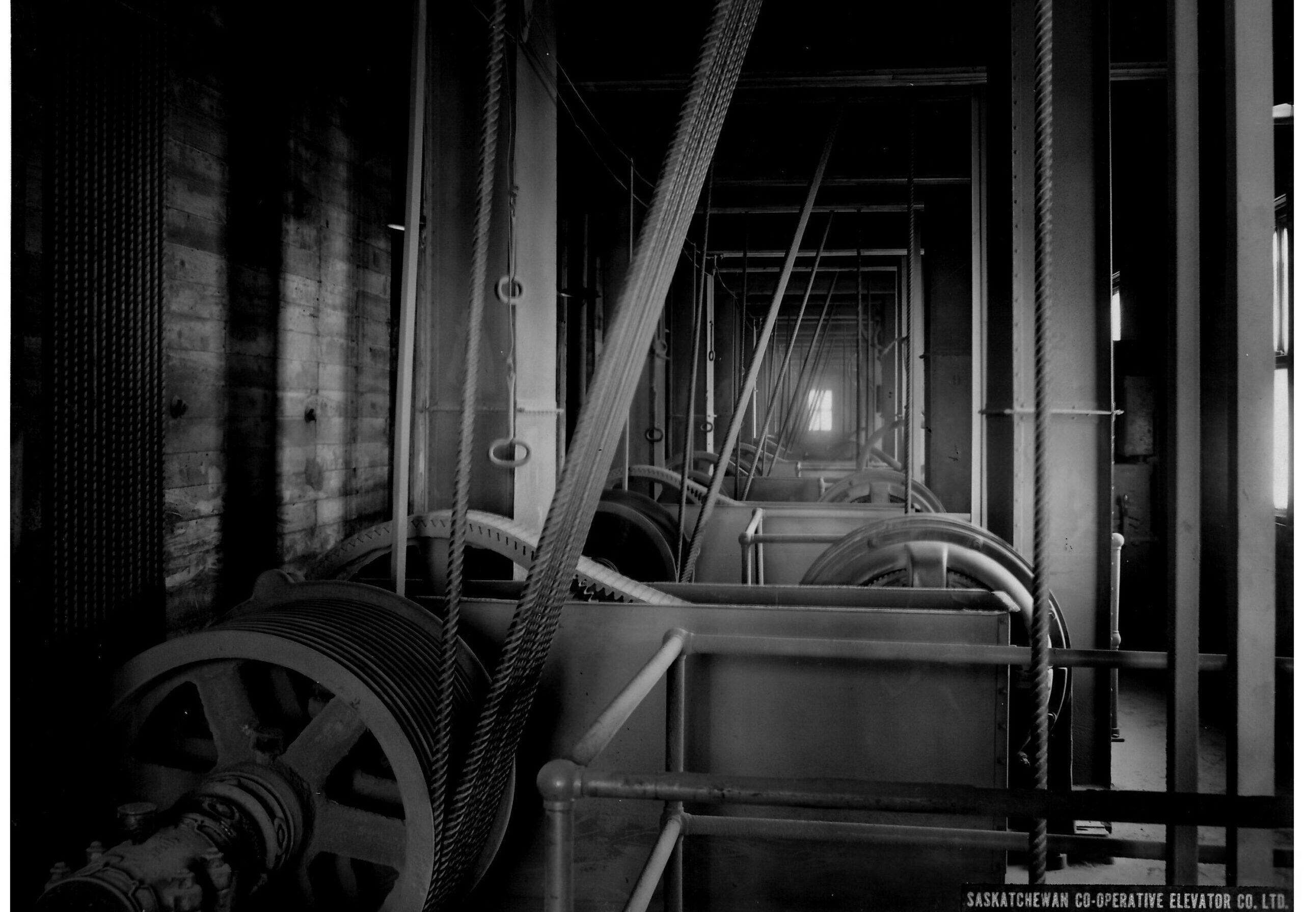 black and white inside of elevator with ropes and pully system for the legs