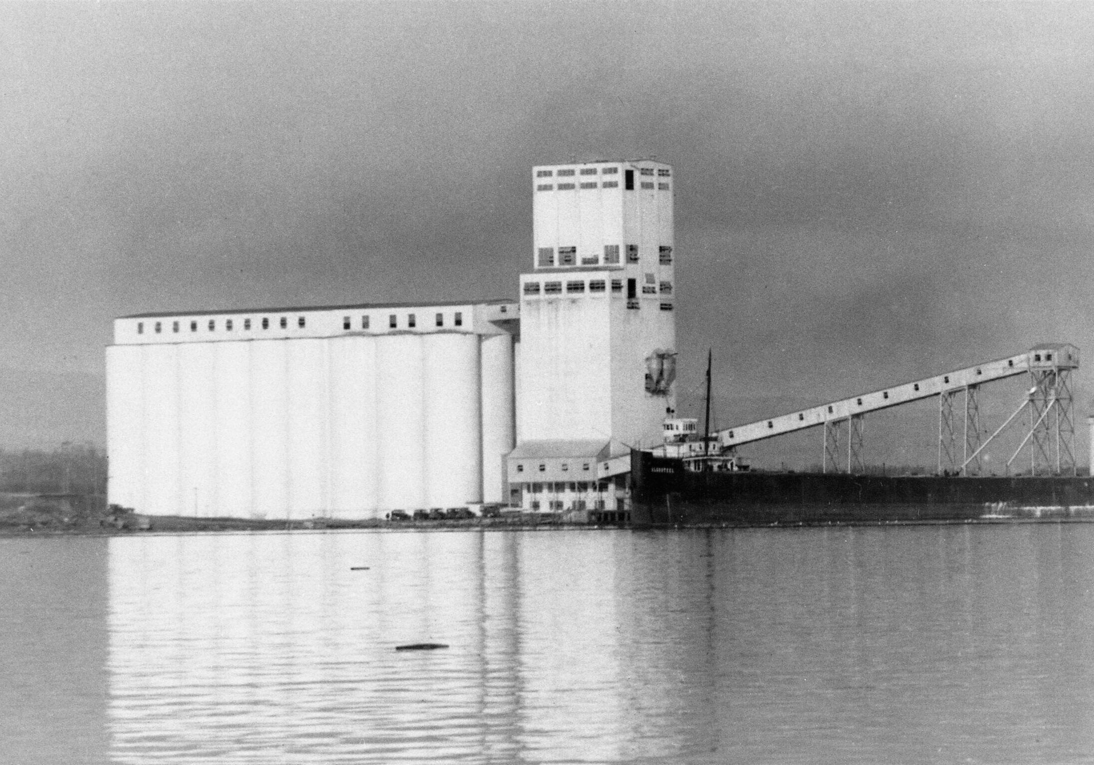 black and white port and elevator in background