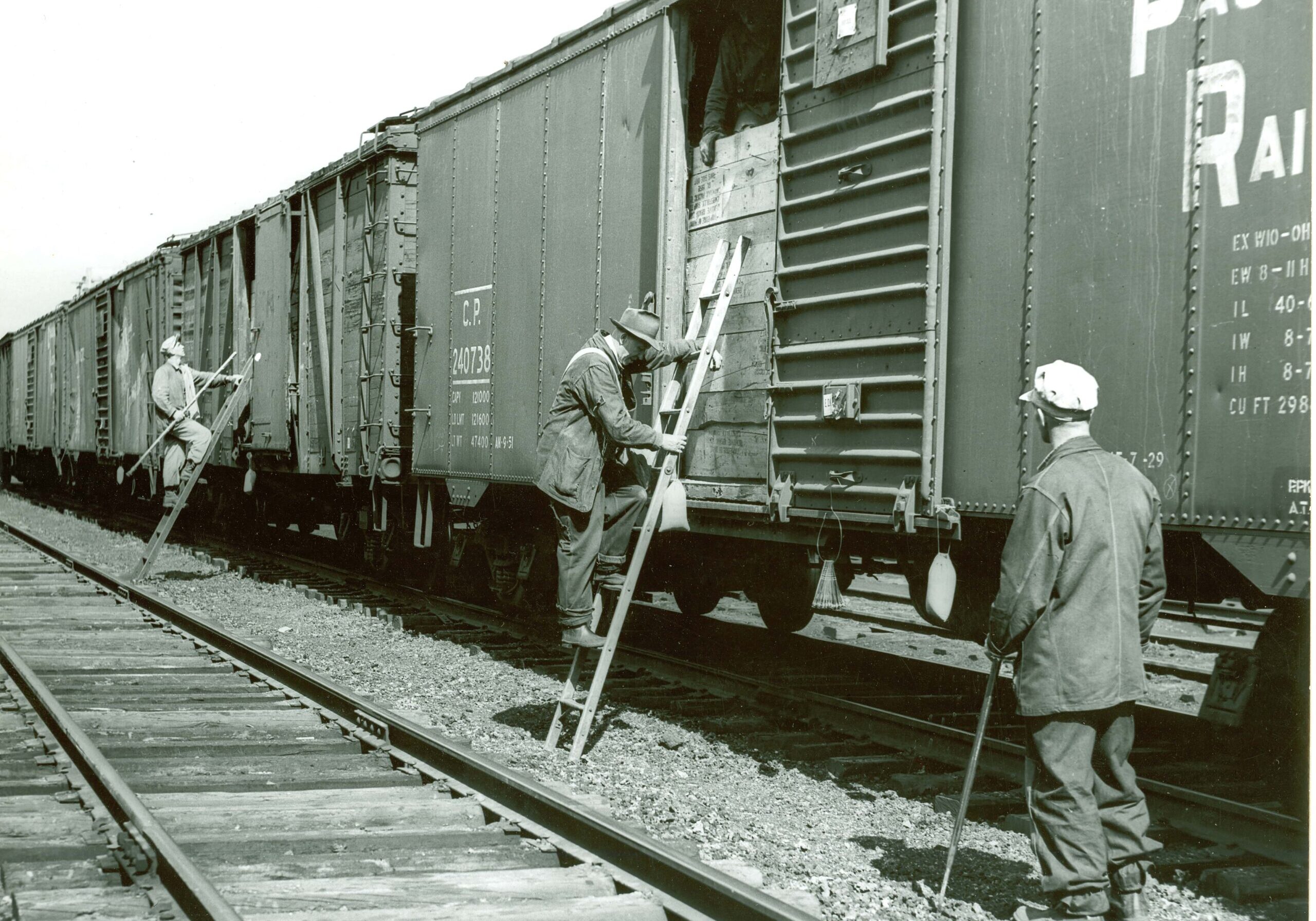 Canadian Grain Commission Samplers Entering Grain Cars showing boxcar doors scan0025-min