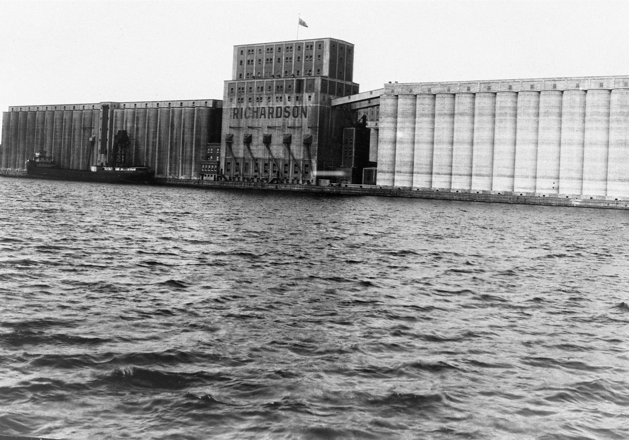 water with elevator in top half of black and white image