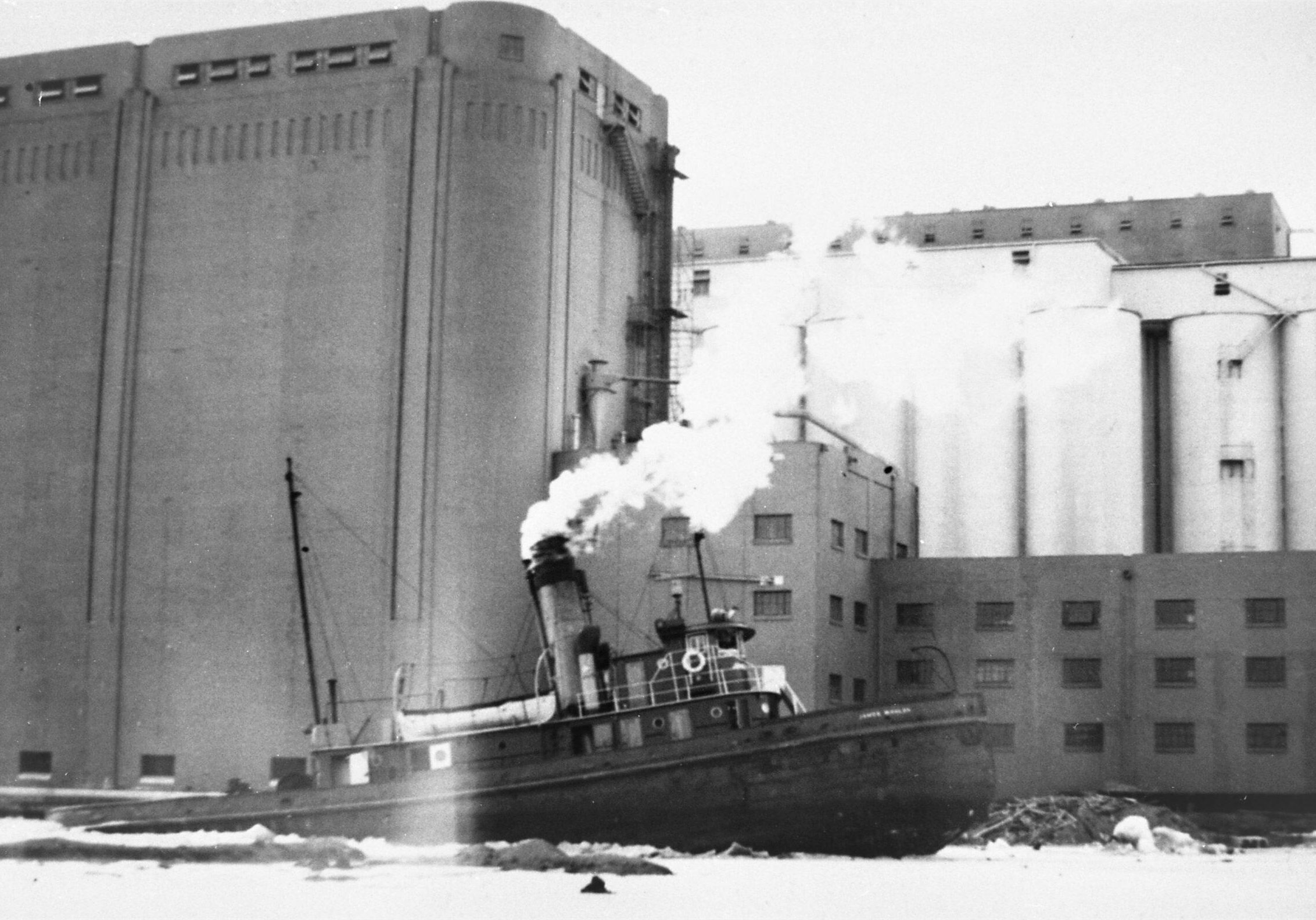 the ship breaking ice at the elevator on the port