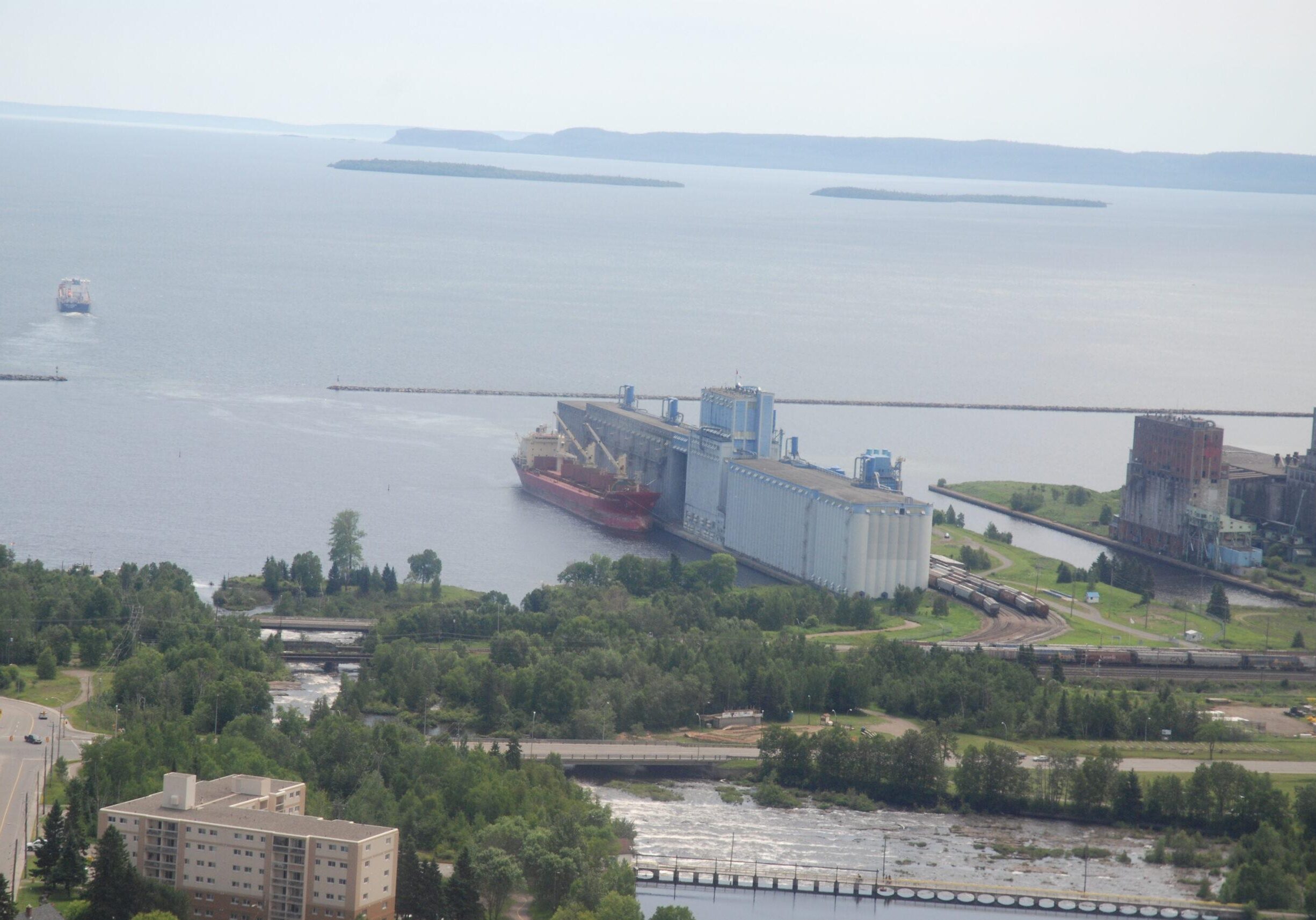 photo of thunder bay waterfront with the terminal elevator and red boat docked beside it